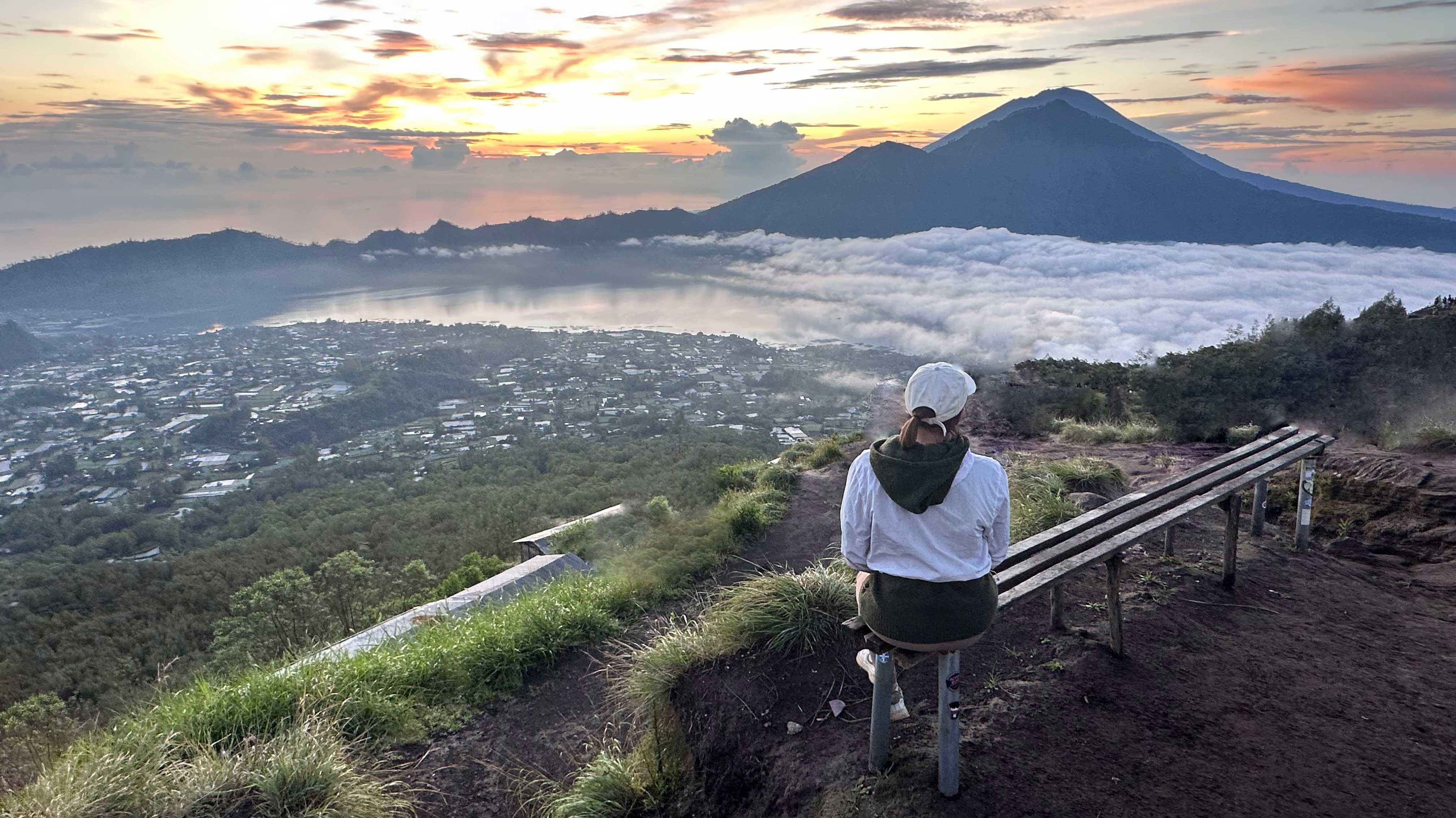 Nicol at Mount Batur volcano in Bali with Mount Agung volcano visible in the background.